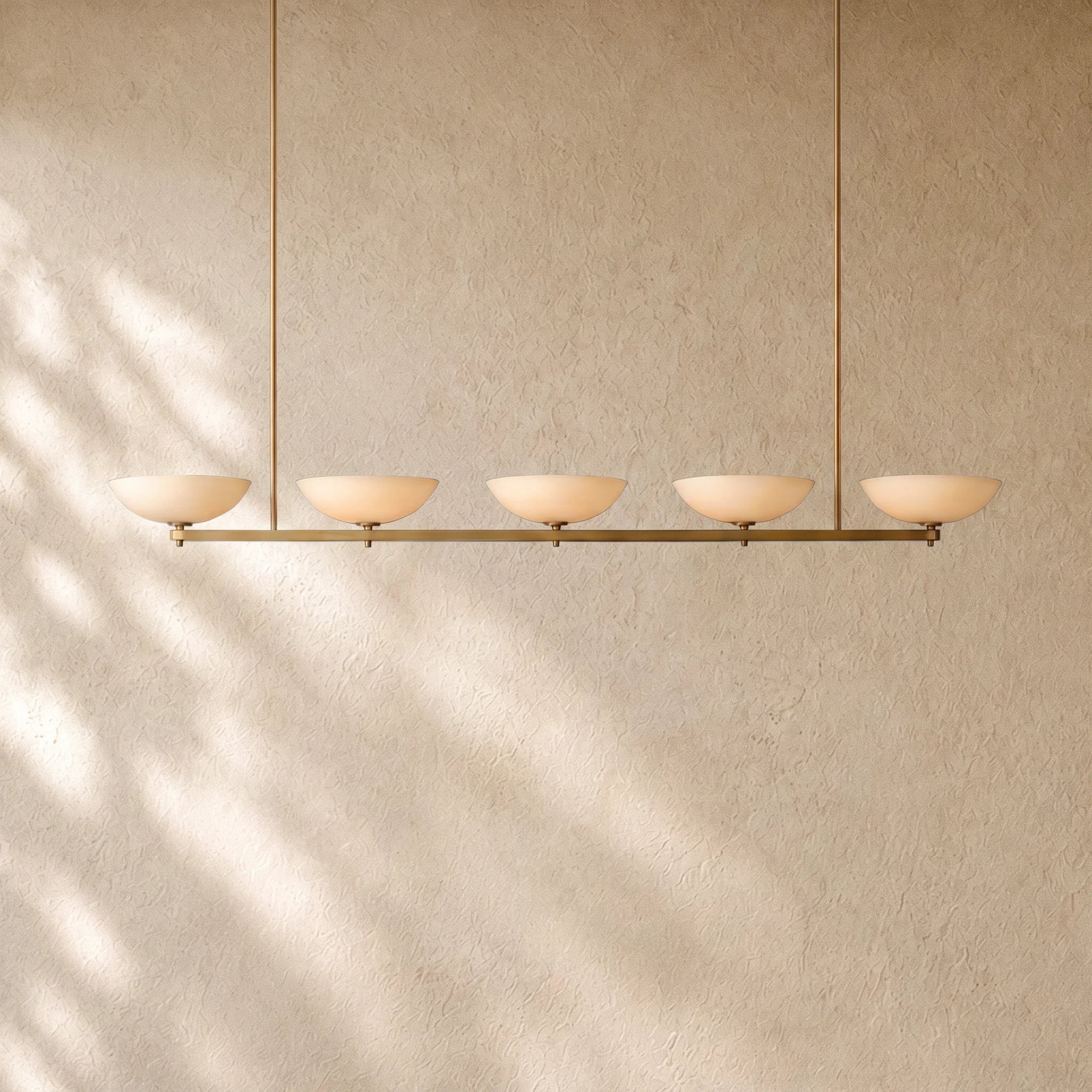 Vernat Linear Chandelier in Vintage Brass